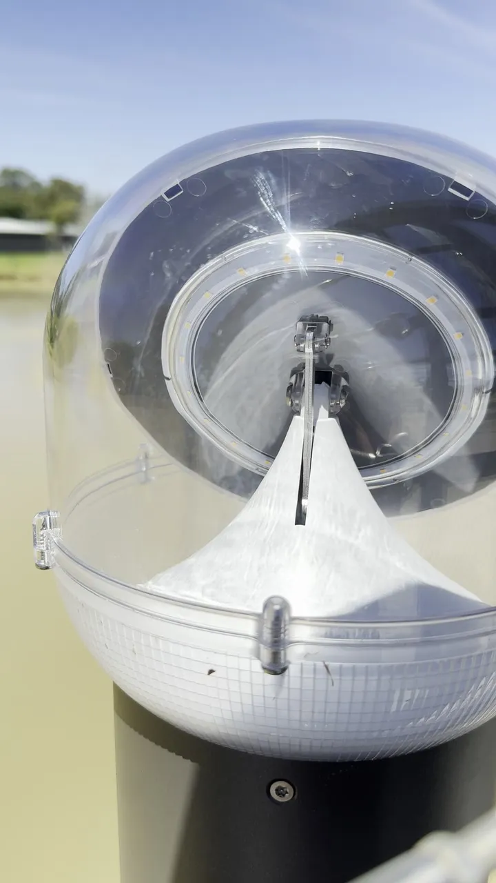 Close-up of a solar bollard head bolted to a footbridge